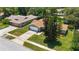 Drone shot showcases this cozy home nestled amongst mature trees in a peaceful neighborhood setting at 226 Selkirk Way, Longwood, FL 32779