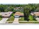 Aerial view of a home with a large front yard and mature trees in a tranquil residential neighborhood at 226 Selkirk Way, Longwood, FL 32779