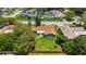 Aerial shot of a cozy home with green lawn, mature trees, and proximity to other residential houses at 226 Selkirk Way, Longwood, FL 32779