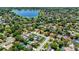 Aerial view of the neighborhood, featuring lush greenery, nearby lake, and well-maintained homes, creating a serene atmosphere at 226 Selkirk Way, Longwood, FL 32779