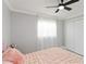 A cozy bedroom featuring a ceiling fan, a closet, and a window with sheer curtains at 226 Selkirk Way, Longwood, FL 32779