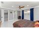 Bright bedroom featuring marble floors, ensuite, and a modern ceiling fan at 226 Selkirk Way, Longwood, FL 32779