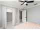 A spacious bedroom with white trim and doorways to the bathroom and walk-in closet at 226 Selkirk Way, Longwood, FL 32779