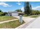 Single-story home has a manicured lawn and a quaint mailbox for easy mail delivery at 226 Selkirk Way, Longwood, FL 32779