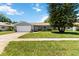 Charming single-story home with well-maintained lawn, brick accents, and lush landscaping at 226 Selkirk Way, Longwood, FL 32779