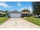 Well-manicured lawn leads to this charming single-story home with a two car garage at 226 Selkirk Way, Longwood, FL 32779