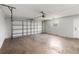 Spacious garage with a white door and some windows at 226 Selkirk Way, Longwood, FL 32779