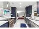 Open kitchen with stainless steel appliances and bright marble floors and counters at 226 Selkirk Way, Longwood, FL 32779