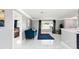 Bright living room with white marble floors, blue couch, and window seat at 226 Selkirk Way, Longwood, FL 32779
