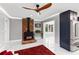 Bright living room with a brick fireplace and a modern ceiling fan at 226 Selkirk Way, Longwood, FL 32779