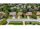 A street view showcases tidy front lawns, driveways and mature trees, depicting a quiet residential neighborhood at 226 Selkirk Way, Longwood, FL 32779