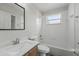 Bright, clean bathroom featuring tiled walls, a combination tub/shower, and a modern vanity at 231 Chestnut Creek Dr, Apopka, FL 32703
