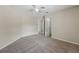 Open bedroom with carpet and ceiling fan offering a flexible living space with natural lighting at 231 Chestnut Creek Dr, Apopka, FL 32703