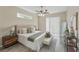 Well-lit primary bedroom with a ceiling fan, walk-in closet, and ensuite bathroom at 231 Chestnut Creek Dr, Apopka, FL 32703