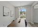 Dining room featuring a modern light fixture, a large window, and stylish decor at 231 Chestnut Creek Dr, Apopka, FL 32703