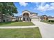 Charming two-story home featuring a well-manicured lawn and inviting curb appeal at 231 Chestnut Creek Dr, Apopka, FL 32703