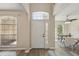 Inviting foyer with a stylish front door, hardwood floors, and ample natural light at 231 Chestnut Creek Dr, Apopka, FL 32703