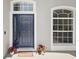 Stylish front door with decorative accents and a welcoming entrance at 231 Chestnut Creek Dr, Apopka, FL 32703