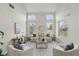 Bright living room with high ceilings, a stylish couch, and views of the pool at 231 Chestnut Creek Dr, Apopka, FL 32703