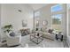 Bright living room with vaulted ceilings, neutral tones, modern furnishings, and ample natural light at 231 Chestnut Creek Dr, Apopka, FL 32703