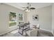Bright home office with large windows, modern ceiling fan, and stylish decor at 231 Chestnut Creek Dr, Apopka, FL 32703