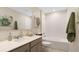 Bathroom featuring a vanity with gray cabinets, quartz countertop, tile floors and shower at 7542 Headwaters Ct, Groveland, FL 34736
