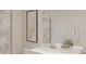 Bright bathroom with a white vanity, decorative succulent, and a gray tiled shower at 245 Streamliner Way, Groveland, FL 34736