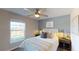 Comfortable bedroom with a queen-sized bed, soft lighting, and neutral color palette at 245 Streamliner Way, Groveland, FL 34736