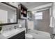Well-lit bathroom with a sleek vanity, a glass-enclosed shower and modern fixtures at 2520 Oakington St, Winter Garden, FL 34787