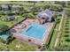 Large community pool with lounge chairs, playground, jacuzzi, and a clubhouse with stairs leading to the second floor at 2520 Oakington St, Winter Garden, FL 34787