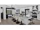 Open concept kitchen featuring a marble island with barstool seating and modern finishes at 2520 Oakington St, Winter Garden, FL 34787