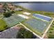 Outdoor tennis court, sand volleyball court, basketball court, and shuffleboard court located by a lake and neighborhood at 2520 Oakington St, Winter Garden, FL 34787