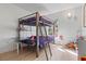 bedroom with a bunk bed, small table, and playful decor at 2742 Sun Key Pl, Kissimmee, FL 34747