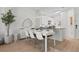 Well-lit dining area featuring modern table, chairs, and stylish decor at 2742 Sun Key Pl, Kissimmee, FL 34747