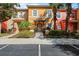 Charming multi-colored townhouse with lush landscaping and inviting front entrance at 2742 Sun Key Pl, Kissimmee, FL 34747