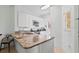 Bright kitchen with granite counters, stainless appliances, and ample storage at 2742 Sun Key Pl, Kissimmee, FL 34747
