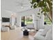 Bright living room with sleek furniture, modern lighting, and view to the backyard at 2742 Sun Key Pl, Kissimmee, FL 34747