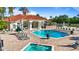 Resort-style pool featuring a large pool deck with plenty of lounge chairs, hot tub and bar area at 2742 Sun Key Pl, Kissimmee, FL 34747