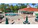 Aerial view of community pool area with chairs and outdoor bar at 2742 Sun Key Pl, Kissimmee, FL 34747