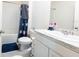 Clean bathroom featuring a shower/tub combo, modern sink, and neutral color palette at 2752 Grand Central Ave, Tavares, FL 32778
