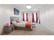 Bright bedroom with a modern bed, colorful curtains, and comfortable carpet at 2752 Grand Central Ave, Tavares, FL 32778
