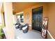 Cozy front porch featuring comfortable seating, decorative accents, and a welcoming entrance at 2752 Grand Central Ave, Tavares, FL 32778