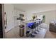 Modern kitchen featuring white cabinets, a stylish backsplash, and an island with bar seating at 2752 Grand Central Ave, Tavares, FL 32778