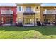 Backyard of townhouse with private patios and manicured lawn at 2756 Sun Key Pl, Kissimmee, FL 34747