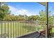 Private balcony offering a tranquil view of lush greenery at 2756 Sun Key Pl, Kissimmee, FL 34747