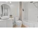 Modern bathroom featuring a vessel sink, soaking tub, and stylish fixtures at 2756 Sun Key Pl, Kissimmee, FL 34747