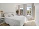 Sun-filled bedroom featuring two large windows, neutral walls, and carpet floors at 2756 Sun Key Pl, Kissimmee, FL 34747