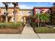 Charming townhome with lush landscaping and a convenient accessible parking space at 2756 Sun Key Pl, Kissimmee, FL 34747