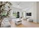 Bright living room with minimalist decor, light wood floors, and sliding doors to the outside at 2756 Sun Key Pl, Kissimmee, FL 34747