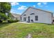 Backyard featuring well maintained lawn, a patio, and a grill at 2776 Joseph Cir, Oviedo, FL 32765